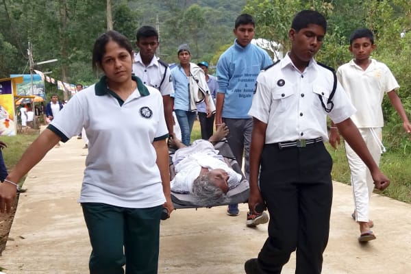 Providing first aid for pilgrims in Sri Lanka