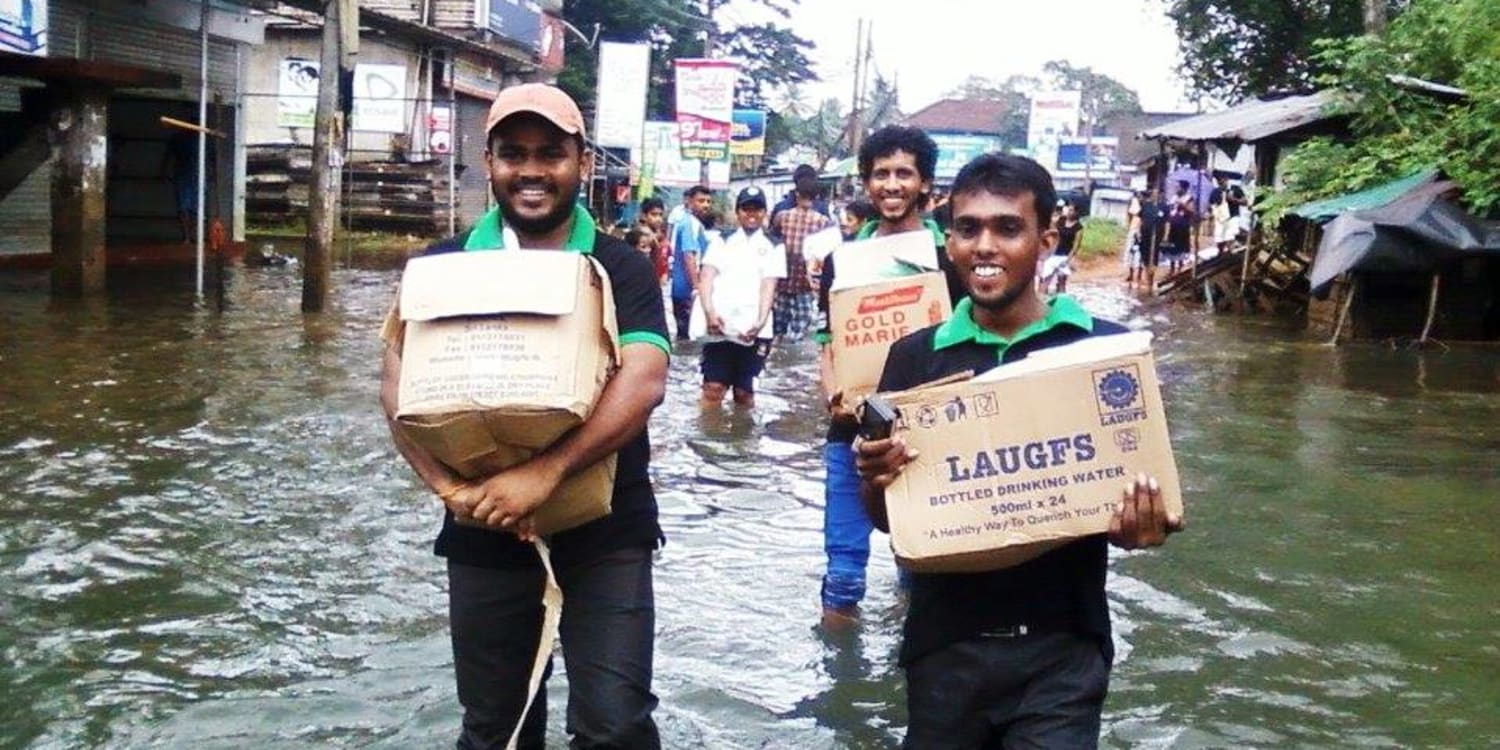 Volunteers from Sri Lanka provides relief aid to flood victims