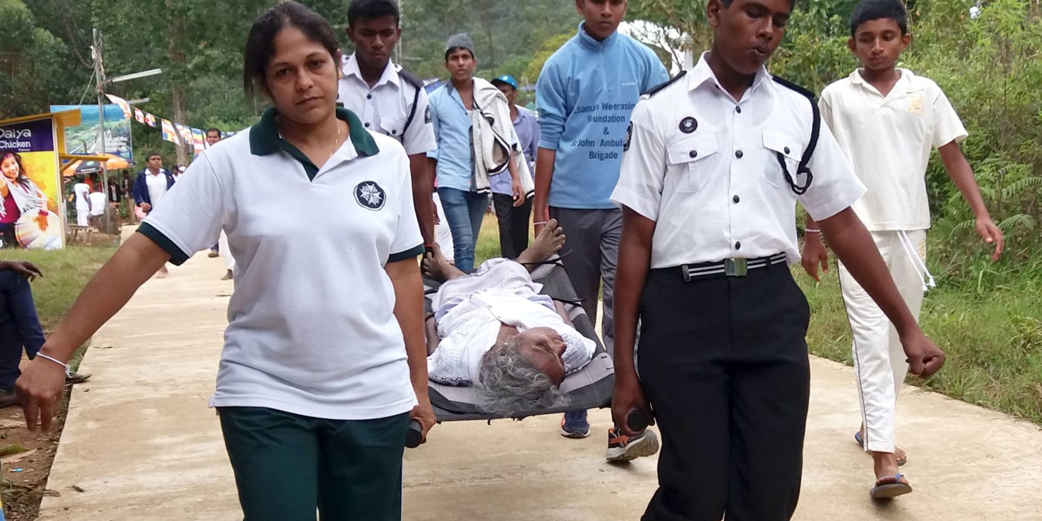 Providing first aid for pilgrims in Sri Lanka