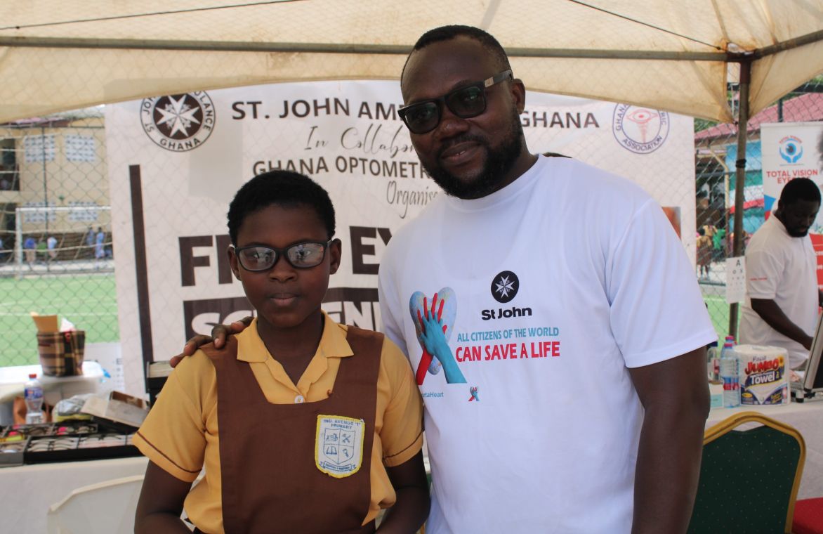 Teacher Godwin Ayikpa And A Beneficiary Scaled